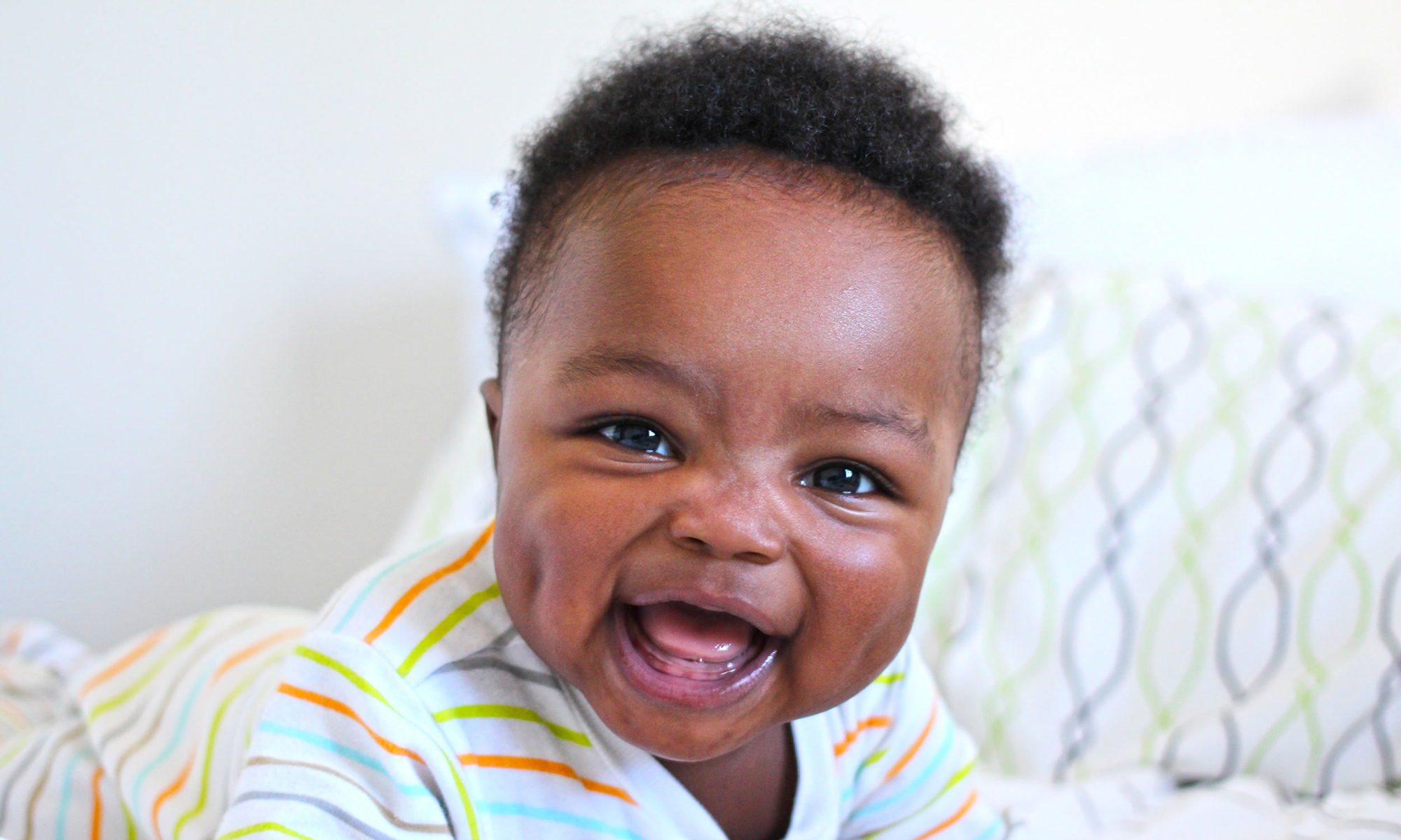 baby laughing at 1 month